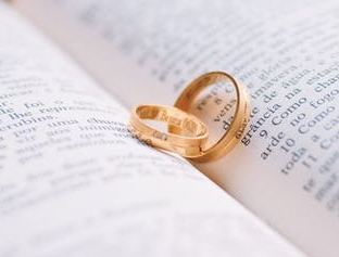 book and wedding rings